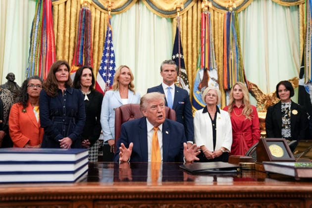 Trump Executive Order Establishing the Presidential Military Spouse Commission WASHINGTON, DC - AUG. 3: U.S. President Donald Trump announces an executive order establishing the Presidential Military Spouse Commission on Monday, Aug. 3, 2026 in the Oval Office at the White House in Washington, D.C. Jennifer Rauchet and United States Secretary of War Pete Hegseth, rear, also attended. Credit: Allison Robbert Pool via CNP Washington District of Columbia United States of America EDITORIAL USE ONLY Copyright: xx ALR01068 AllisonxRobbertxx-xPoolxviaxCNPx cnpphotos338664