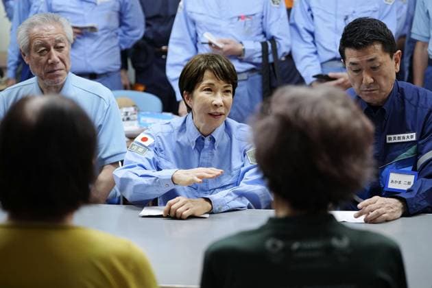Japan PM Takaichi visits quake-hit Kumamoto Japanese Prime Minister Sanae Takaichi (C) meets with people at an evacuation center in Hikawa in Kumamoto Prefecture on Aug. 3, 2026, after a powerful earthquake struck the southwestern Japan prefecture and its vicinity on July 28. (Pool photo)  A14AA0005625010P