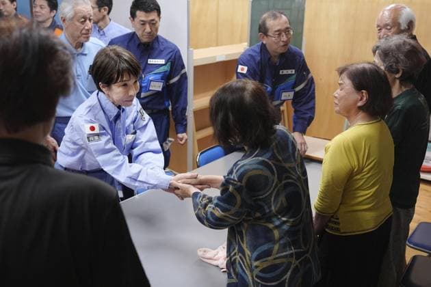 Japan PM Takaichi visits quake-hit Kumamoto Japanese Prime Minister Sanae Takaichi (L) shakes hands with people at an evacuation center in Hikawa in Kumamoto Prefecture on Aug. 3, 2026, after a powerful earthquake struck the southwestern Japan prefecture and its vicinity on July 28. (Pool photo)  A14AA0005625011P
