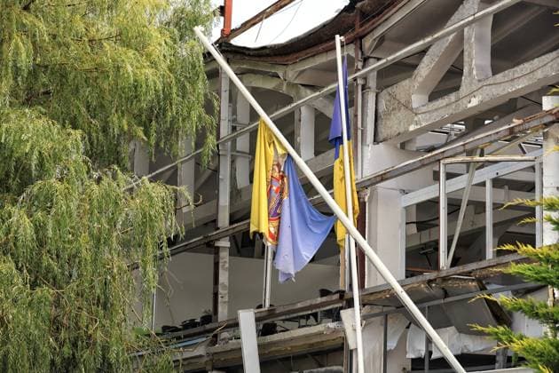 Tattered flags hang on broken flagpoles at the premises of a transport infrastructure facility damaged by a Russian strike in Odesa region, Ukraine, August 3, 2026. At least 13 civilians were injured in the attack, four of whom were hospitalised. The transport facility and nearby warehouses sustained significant damage. Thirteen cars and two buses were also wrecked. (Photo by Nina Liashonok Ukrinform) Russian troops attack transport infrastructure in Odesa region  Copyright: xNinaxLiashonokx