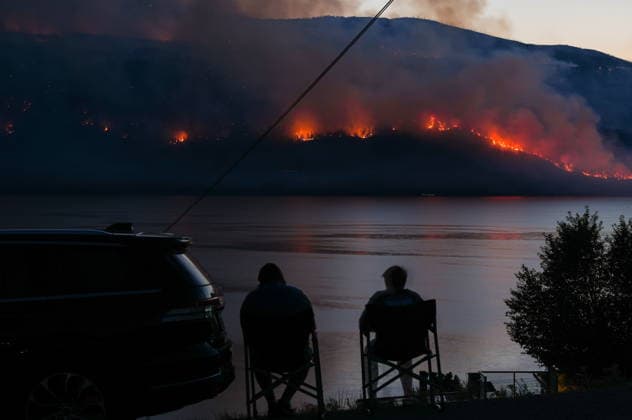 August 3, 2026, Lake Country, Bc, CANADA: People in Lake Country, B.C., watch as the Quilpituk Creek wildfire burns on the mountainside across Okanagan Lake, near Fintry, on Monday, August 3, 2026. Lake Country CANADA  - ZUMAc35_ 20260803_zaf_c35_113 Copyright: xDarrylxDyckx