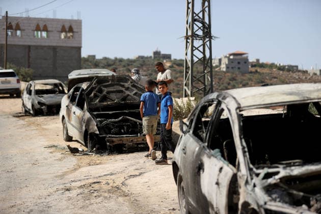 Israeli settlers set fire to three cars and damaged a power line in Nablus NABLUS, WEST BANK, PALESTINE - AUGUST 04: Palestinians inspect burnt-out cars following a raid by Israeli settlers who attacked homes, set three cars on fire, and damaged power lines between the villages of Jalud and Telfit near Nablus in West Bank, Palestine on August 04, 2026. Issam Rimawi Anadolu Nablus West Bank. Editorial use only. Please get in touch for any other usage.  Copyright: x2026xAnadoluxIssamxRimawix