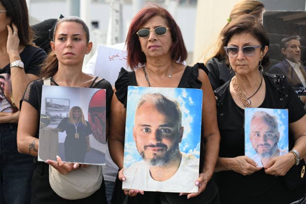 Memorial ceremony held in Lebanon to mark sixth anniversary of Beirut Port explosion BEIRUT, LEBANON - AUGUST 4: People attend a memorial ceremony held in front of the monument bearing the names of those killed in the Aug. 4, 2020 Beirut Port explosion, marking the sixth anniversary of the disaster while holding photos, in Beirut, Lebanon, on August 4, 2026. The ceremony was attended by families of the victims, Lebanese Justice Minister Adel Nassar, Information Minister Paul Markus, Social Affairs Minister Haneen El Sayed, ambassadors of several countries that lost citizens in the explosion, and other members of the diplomatic corps. Houssam Shbaro Anadolu Beirut Lebanon. Editorial use only. Please get in touch for any other usage.  Copyright: x2026xAnadoluxHoussamxShbarox