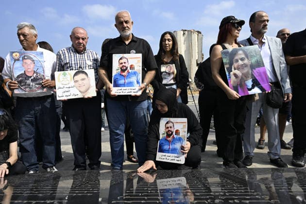 Memorial ceremony held in Lebanon to mark sixth anniversary of Beirut Port explosion BEIRUT, LEBANON - AUGUST 4: People attend a memorial ceremony held in front of the monument bearing the names of those killed in the Aug. 4, 2020 Beirut Port explosion, marking the sixth anniversary of the disaster while holding photos, in Beirut, Lebanon, on August 4, 2026. The ceremony was attended by families of the victims, Lebanese Justice Minister Adel Nassar, Information Minister Paul Markus, Social Affairs Minister Haneen El Sayed, ambassadors of several countries that lost citizens in the explosion, and other members of the diplomatic corps. Houssam Shbaro Anadolu Beirut Lebanon. Editorial use only. Please get in touch for any other usage.  Copyright: x2026xAnadoluxHoussamxShbarox