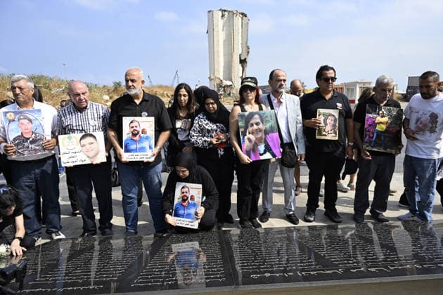 Memorial ceremony held in Lebanon to mark sixth anniversary of Beirut Port explosion BEIRUT, LEBANON - AUGUST 4: People attend a memorial ceremony held in front of the monument bearing the names of those killed in the Aug. 4, 2020 Beirut Port explosion, marking the sixth anniversary of the disaster while holding photos, in Beirut, Lebanon, on August 4, 2026. The ceremony was attended by families of the victims, Lebanese Justice Minister Adel Nassar, Information Minister Paul Markus, Social Affairs Minister Haneen El Sayed, ambassadors of several countries that lost citizens in the explosion, and other members of the diplomatic corps. Houssam Shbaro Anadolu Beirut Lebanon. Editorial use only. Please get in touch for any other usage.  Copyright: x2026xAnadoluxHoussamxShbarox