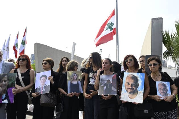 Memorial ceremony held in Lebanon to mark sixth anniversary of Beirut Port explosion BEIRUT, LEBANON - AUGUST 4: People attend a memorial ceremony held in front of the monument bearing the names of those killed in the Aug. 4, 2020 Beirut Port explosion, marking the sixth anniversary of the disaster while holding photos, in Beirut, Lebanon, on August 4, 2026. The ceremony was attended by families of the victims, Lebanese Justice Minister Adel Nassar, Information Minister Paul Markus, Social Affairs Minister Haneen El Sayed, ambassadors of several countries that lost citizens in the explosion, and other members of the diplomatic corps. Houssam Shbaro Anadolu Beirut Lebanon. Editorial use only. Please get in touch for any other usage.  Copyright: x2026xAnadoluxHoussamxShbarox