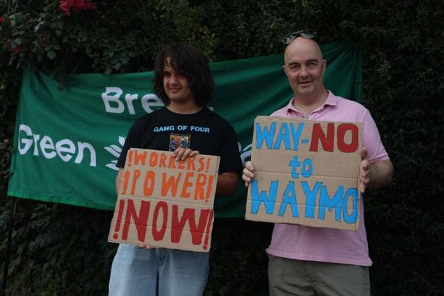 August 4, 2026, London, England, United Kingdom: Members of the App Drivers & Couriers Union (ADCU), Brent Green Party and the Pull the Plug on Waymo campaign attend a protest outside WAYMO s offices in Park Royal, London, opposing the expansion of autonomous vehicles. Demonstrators argued that driverless technology threatens drivers job security and livelihoods and called for greater protections for workers rights. London United Kingdom - ZUMAa279 20260804_zsp_a279_001 Copyright: xZeynepxDemirxAslimx