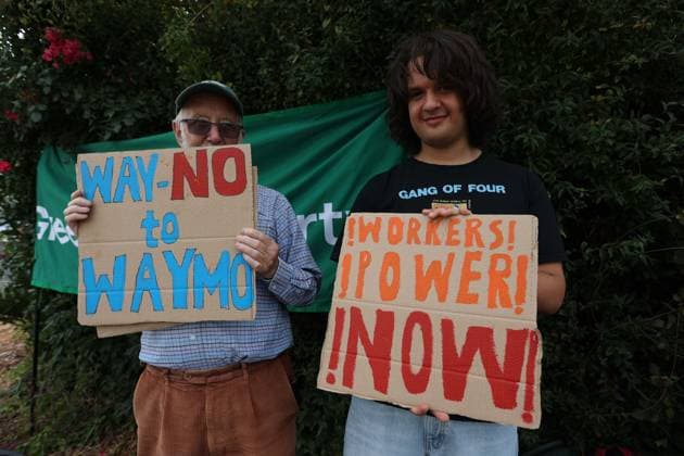 August 4, 2026, London, England, United Kingdom: Members of the App Drivers & Couriers Union (ADCU), Brent Green Party and the Pull the Plug on Waymo campaign attend a protest outside WAYMO s offices in Park Royal, London, opposing the expansion of autonomous vehicles. Demonstrators argued that driverless technology threatens drivers job security and livelihoods and called for greater protections for workers rights. London United Kingdom  - ZUMAa279 20260804_zsp_a279_004 Copyright: xZeynepxDemirxAslimx