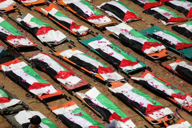 Mass funeral held for recovered remains in Gaza City s Sabra neighborhood Palestinians take part in a mass funeral for the recovered remains of members of the Abu Sharia and Al-Hasayna families in the Sabra neighborhood of Gaza City on August 4, 2026. The remains were recently recovered from beneath the rubble of their homes, which were destroyed in an Israeli strike earlier in the war. Gaza s Civil Defense said its crews recovered the remains of 112 people during a two-week operation in the residential area where the two families lived, which it said was hit in an Israeli airstrike on November 23, 2023. The Civil Defense estimates that more than 9,000 people remain missing or buried beneath the rubble of destroyed buildings across the Gaza Copyright: xapaimagesxBilalxOsamax xapaimagesx