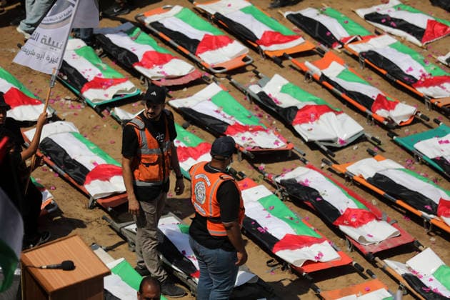 Mass funeral held for recovered remains in Gaza City s Sabra neighborhood Palestinians take part in a mass funeral for the recovered remains of members of the Abu Sharia and Al-Hasayna families in the Sabra neighborhood of Gaza City on August 4, 2026. The remains were recently recovered from beneath the rubble of their homes, which were destroyed in an Israeli strike earlier in the war. Gaza s Civil Defense said its crews recovered the remains of 112 people during a two-week operation in the residential area where the two families lived, which it said was hit in an Israeli airstrike on November 23, 2023. The Civil Defense estimates that more than 9,000 people remain missing or buried beneath the rubble of destroyed buildings across the Gaza Copyright: xapaimagesxBilalxOsamax xapaimagesx