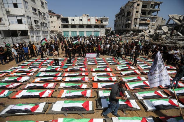 Mass funeral held for recovered remains in Gaza City s Sabra neighborhood Palestinians take part in a mass funeral for the recovered remains of members of the Abu Sharia and Al-Hasayna families in the Sabra neighborhood of Gaza City on August 4, 2026. The remains were recently recovered from beneath the rubble of their homes, which were destroyed in an Israeli strike earlier in the war. Gaza s Civil Defense said its crews recovered the remains of 112 people during a two-week operation in the residential area where the two families lived, which it said was hit in an Israeli airstrike on November 23, 2023. The Civil Defense estimates that more than 9,000 people remain missing or buried beneath the rubble of destroyed buildings across the Gaza Copyright: xapaimagesxBilalxOsamax xapaimagesx