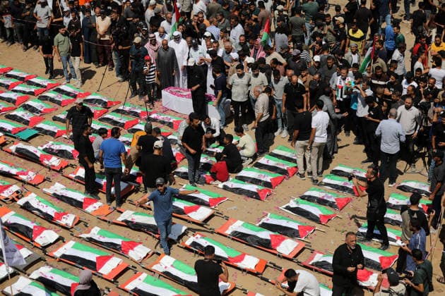 Mass funeral held for recovered remains in Gaza City s Sabra neighborhood Palestinians take part in a mass funeral for the recovered remains of members of the Abu Sharia and Al-Hasayna families in the Sabra neighborhood of Gaza City on August 4, 2026. The remains were recently recovered from beneath the rubble of their homes, which were destroyed in an Israeli strike earlier in the war. Gaza s Civil Defense said its crews recovered the remains of 112 people during a two-week operation in the residential area where the two families lived, which it said was hit in an Israeli airstrike on November 23, 2023. The Civil Defense estimates that more than 9,000 people remain missing or buried beneath the rubble of destroyed buildings across the Gaza Copyright: xapaimagesxBilalxOsamax xapaimagesx