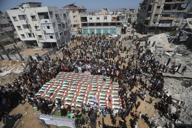 Mass funeral held for recovered remains in Gaza City s Sabra neighborhood Palestinians take part in a mass funeral for the recovered remains of members of the Abu Sharia and Al-Hasayna families in the Sabra neighborhood of Gaza City on August 4, 2026. The remains were recently recovered from beneath the rubble of their homes, which were destroyed in an Israeli strike earlier in the war. Gaza s Civil Defense said its crews recovered the remains of 112 people during a two-week operation in the residential area where the two families lived, which it said was hit in an Israeli airstrike on November 23, 2023. The Civil Defense estimates that more than 9,000 people remain missing or buried beneath the rubble of destroyed buildings across the Gaza Copyright: xapaimagesxBilalxOsamax xapaimagesx