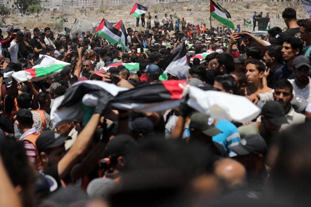 Mass funeral held for recovered remains in Gaza City s Sabra neighborhood Palestinians take part in a mass funeral for the recovered remains of members of the Abu Sharia and Al-Hasayna families in the Sabra neighborhood of Gaza City on August 4, 2026. The remains were recently recovered from beneath the rubble of their homes, which were destroyed in an Israeli strike earlier in the war. Gaza s Civil Defense said its crews recovered the remains of 112 people during a two-week operation in the residential area where the two families lived, which it said was hit in an Israeli airstrike on November 23, 2023. The Civil Defense estimates that more than 9,000 people remain missing or buried beneath the rubble of destroyed buildings across the Gaza Copyright: xapaimagesxBilalxOsamax xapaimagesx