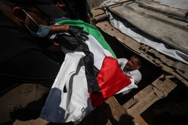 Palestinians mourn 112 people retrieved from rubble in Gaza GAZA, PALESTINE - AUGUST 04: Palestinians carry the bodies of 112 Palestinians during a mass funeral ceremony in Gaza, Palestine, on August 04, 2026. The 112 Palestinians were killed in Israeli attacks targeting the area where the Hasayine and Abu Sharia families lived in the Sabra neighborhood of Gaza City in November 2023 and were retrieved from the rubble nearly three years later. Ali Jadallah Anadolu Gaza Palestine. Editorial use only. Please get in touch for any other usage.  Copyright: x2026xAnadoluxAlixJadallahx
