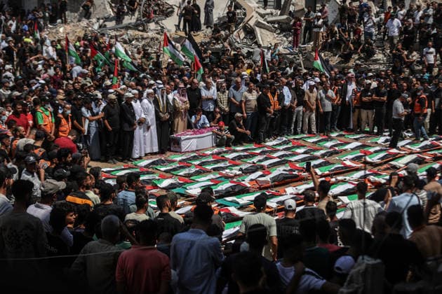 Palestinians mourn 112 people retrieved from rubble in Gaza GAZA, PALESTINE - AUGUST 04: Palestinians take part in a funeral for 112 Palestinians in Gaza, Palestine, on August 04, 2026. The 112 Palestinians were killed in Israeli attacks targeting the area where the Hasayine and Abu Sharia families lived in the Sabra neighborhood of Gaza City in November 2023, and their bodies were retrieved from the rubble nearly three years later. Ali Jadallah Anadolu Gaza Palestine. Editorial use only. Please get in touch for any other usage.  Copyright: x2026xAnadoluxAlixJadallahx