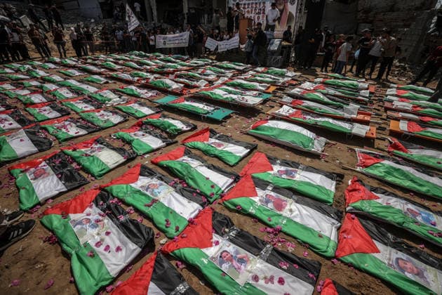 Palestinians mourn 112 people retrieved from rubble in Gaza GAZA, PALESTINE - AUGUST 04: Palestinians take part in a funeral for 112 Palestinians in Gaza, Palestine, on August 04, 2026. The 112 Palestinians were killed in Israeli attacks targeting the area where the Hasayine and Abu Sharia families lived in the Sabra neighborhood of Gaza City in November 2023, and their bodies were retrieved from the rubble nearly three years later. Ali Jadallah Anadolu Gaza Palestine. Editorial use only. Please get in touch for any other usage.  Copyright: x2026xAnadoluxAlixJadallahx