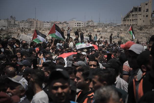 Palestinians Hold Mass Funeral for 112 Members of Two Families in Gaza GAZA CITY, PALESTINE August 4, 2026: Palestinians carry the remains of 112 members of the Al-Hassaina and Abu Sharia families during a mass funeral procession in the Al-Sabra neighborhood of Gaza City on August 4, 2026. The victims were killed in separate Israeli attacks during the war that began on October 7, 2023, and their bodies were recovered from beneath the rubble months later. According to local authorities, the procession was among the largest funeral processions held in the Gaza Strip since the beginning of the war. Gaza Palestine, State of Copyright: x xMohammedxMxSkaikx xJNAxPressx