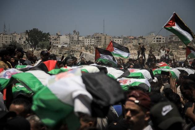 Palestinians Hold Mass Funeral for 112 Members of Two Families in Gaza GAZA CITY, PALESTINE August 4, 2026: Palestinians carry the remains of 112 members of the Al-Hassaina and Abu Sharia families during a mass funeral procession in the Al-Sabra neighborhood of Gaza City on August 4, 2026. The victims were killed in separate Israeli attacks during the war that began on October 7, 2023, and their bodies were recovered from beneath the rubble months later. According to local authorities, the procession was among the largest funeral processions held in the Gaza Strip since the beginning of the war. Gaza Palestine, State of Copyright: x xMohammedxMxSkaikx xJNAxPressx