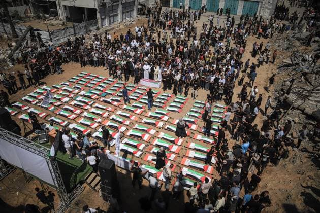 Palestinians Hold Mass Funeral for 112 Members of Two Families in Gaza GAZA CITY, PALESTINE August 4, 2026: Palestinians carry the remains of 112 members of the Al-Hassaina and Abu Sharia families during a mass funeral procession in the Al-Sabra neighborhood of Gaza City on August 4, 2026. The victims were killed in separate Israeli attacks during the war that began on October 7, 2023, and their bodies were recovered from beneath the rubble months later. According to local authorities, the procession was among the largest funeral processions held in the Gaza Strip since the beginning of the war. Gaza Palestine, State of Copyright: x xMohammedxMxSkaikx xJNAxPressx
