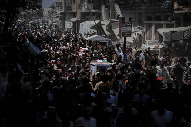 Palestinians Hold Mass Funeral for 112 Members of Two Families in Gaza GAZA CITY, PALESTINE August 4, 2026: Palestinians carry the remains of 112 members of the Al-Hassaina and Abu Sharia families during a mass funeral procession in the Al-Sabra neighborhood of Gaza City on August 4, 2026. The victims were killed in separate Israeli attacks during the war that began on October 7, 2023, and their bodies were recovered from beneath the rubble months later. According to local authorities, the procession was among the largest funeral processions held in the Gaza Strip since the beginning of the war. Gaza Palestine, State of Copyright: x xMohammedxMxSkaikx xJNAxPressx