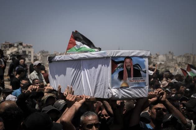 Palestinians Hold Mass Funeral for 112 Members of Two Families in Gaza GAZA CITY, PALESTINE August 4, 2026: Palestinians carry the remains of 112 members of the Al-Hassaina and Abu Sharia families during a mass funeral procession in the Al-Sabra neighborhood of Gaza City on August 4, 2026. The victims were killed in separate Israeli attacks during the war that began on October 7, 2023, and their bodies were recovered from beneath the rubble months later. According to local authorities, the procession was among the largest funeral processions held in the Gaza Strip since the beginning of the war. Gaza Palestine, State of Copyright: x xMohammedxMxSkaikx xJNAxPressx