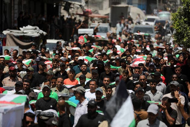 Mass funeral held for recovered remains in Gaza City s Sabra neighborhood Palestinians take part in a mass funeral for the recovered remains of members of the Abu Sharia and Al-Hasayna families in the Sabra neighborhood of Gaza City on August 4, 2026. The remains were recently recovered from beneath the rubble of their homes, which were destroyed in an Israeli strike earlier in the war. Gaza s Civil Defense said its crews recovered the remains of 112 people during a two-week operation in the residential area where the two families lived, which it said was hit in an Israeli airstrike on November 23, 2023. The Civil Defense estimates that more than 9,000 people remain missing or buried beneath the rubble of destroyed buildings across the Gaza Copyright: xapaimagesxBilalxOsamax xapaimagesx