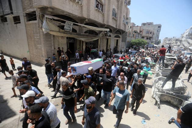 Mass funeral held for recovered remains in Gaza City s Sabra neighborhood Palestinians take part in a mass funeral for the recovered remains of members of the Abu Sharia and Al-Hasayna families in the Sabra neighborhood of Gaza City on August 4, 2026. The remains were recently recovered from beneath the rubble of their homes, which were destroyed in an Israeli strike earlier in the war. Gaza s Civil Defense said its crews recovered the remains of 112 people during a two-week operation in the residential area where the two families lived, which it said was hit in an Israeli airstrike on November 23, 2023. The Civil Defense estimates that more than 9,000 people remain missing or buried beneath the rubble of destroyed buildings across the Gaza Copyright: xapaimagesxBilalxOsamax xapaimagesx