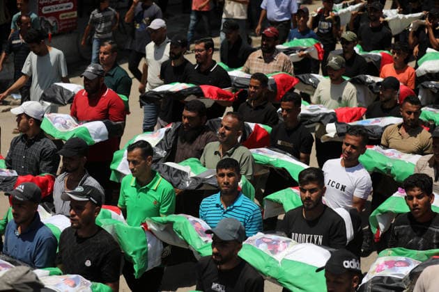 Mass funeral held for recovered remains in Gaza City s Sabra neighborhood Palestinians take part in a mass funeral for the recovered remains of members of the Abu Sharia and Al-Hasayna families in the Sabra neighborhood of Gaza City on August 4, 2026. The remains were recently recovered from beneath the rubble of their homes, which were destroyed in an Israeli strike earlier in the war. Gaza s Civil Defense said its crews recovered the remains of 112 people during a two-week operation in the residential area where the two families lived, which it said was hit in an Israeli airstrike on November 23, 2023. The Civil Defense estimates that more than 9,000 people remain missing or buried beneath the rubble of destroyed buildings across the Gaza Copyright: xapaimagesxBilalxOsamax xapaimagesx