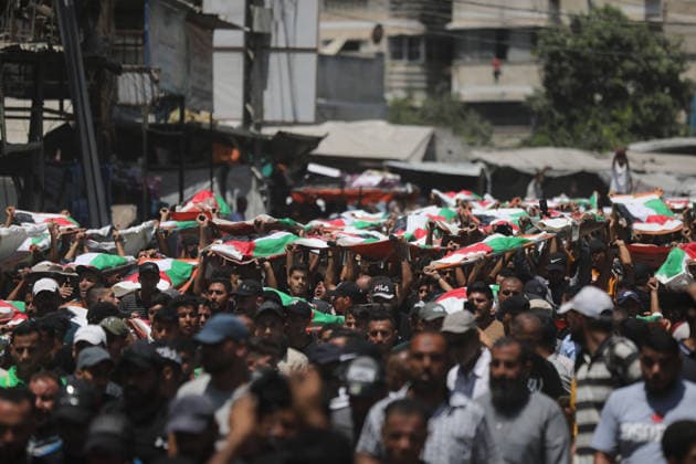 Mass funeral held for recovered remains in Gaza City s Sabra neighborhood Palestinians take part in a mass funeral for the recovered remains of members of the Abu Sharia and Al-Hasayna families in the Sabra neighborhood of Gaza City on August 4, 2026. The remains were recently recovered from beneath the rubble of their homes, which were destroyed in an Israeli strike earlier in the war. Gaza s Civil Defense said its crews recovered the remains of 112 people during a two-week operation in the residential area where the two families lived, which it said was hit in an Israeli airstrike on November 23, 2023. The Civil Defense estimates that more than 9,000 people remain missing or buried beneath the rubble of destroyed buildings across the Gaza Copyright: xapaimagesxBilalxOsamax xapaimagesx