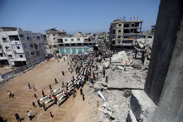 Mass funeral held for recovered remains in Gaza City s Sabra neighborhood Palestinians take part in a mass funeral for the recovered remains of members of the Abu Sharia and Al-Hasayna families in the Sabra neighborhood of Gaza City on August 4, 2026. The remains were recently recovered from beneath the rubble of their homes, which were destroyed in an Israeli strike earlier in the war. Gaza s Civil Defense said its crews recovered the remains of 112 people during a two-week operation in the residential area where the two families lived, which it said was hit in an Israeli airstrike on November 23, 2023. The Civil Defense estimates that more than 9,000 people remain missing or buried beneath the rubble of destroyed buildings across the Gaza Copyright: xapaimagesxBilalxOsamax xapaimagesx