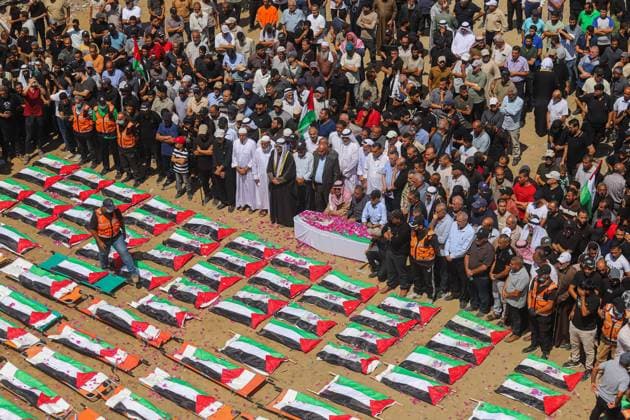 Funeral Of 112 Members Of The Hassayna And Abu Sharia Clan, Who Were Killed In An Israeli Strike GAZA CITY, PALESTINIAN TERRITORIES AUGUST 4, 2026: Palestinians attend the funeral of 112 members of the Hassayna and Abu Sharia families, who were killed in an Israeli strike in 2023 and whose remains were recently recovered from beneath the rubble, according to Gaza s Civil Defense, in Gaza City on August 4, 2026. Gaza Palestine, State of Copyright: x xRamezxHabboubx xJNAxPressx
