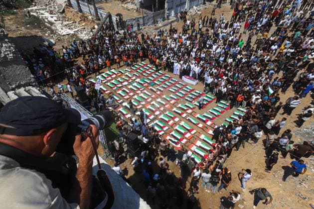 Funeral Of 112 Members Of The Hassayna And Abu Sharia Clan, Who Were Killed In An Israeli Strike GAZA CITY, PALESTINIAN TERRITORIES AUGUST 4, 2026: Palestinians attend the funeral of 112 members of the Hassayna and Abu Sharia families, who were killed in an Israeli strike in 2023 and whose remains were recently recovered from beneath the rubble, according to Gaza s Civil Defense, in Gaza City on August 4, 2026. Gaza Palestine, State of Copyright: x xRamezxHabboubx xJNAxPressx