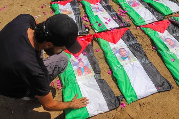 August 4, 2026, Gaza, Palestine, State of: GAZA Gaza, PALESTINIAN TERRITORIES Ã¢â‚¬ AUGUST 4, 2026: Palestinians attend the funeral of 112 members of the Hassayna and Abu Sharia families, who were killed in an Israeli strike in 2023 and whose remains were recently recovered from beneath the rubble, according to Gaza s Civil Defense, in Gaza City on August 4, 2026. Gaza Palestine, State of - ZUMAq101 20260804_zna_q101_030 Copyright: xRamezxHabboubx