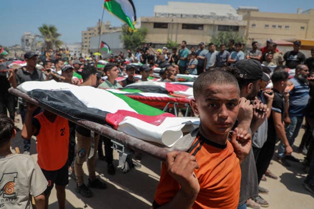 Palestinians Hold Mass Funeral For 112 Family Members In Gaza - Palestine A photograph shows the flag-covered remains of members of the Abu Sharia and al-Hasayna families, recently recovered from the rubble of residential buildings in the al-Sabra neighbourhood which were struck by Israeli bombardments in November 2023, during a mass funeral in Gaza City on August 4, 2026. An October ceasefire remains in place between Israel and Hamas, but it has not halted the violence in Gaza. Photo by Photo by Rizek ELdremle ABACAPRESS.COM Gaza City Palestine  Copyright: xEldremlexRizek ABACAx