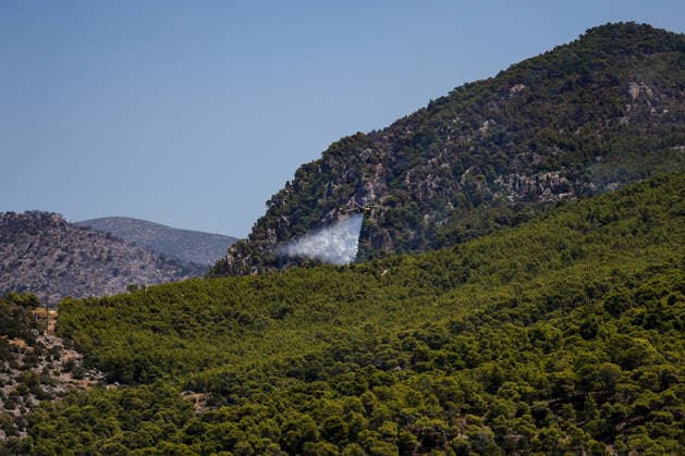Wildfire continues for fourth day in Psatha, Greece PSATHA, GREECE - AUGUST 04: Helicopters continue firefighting operations as a wildfire burns for the fourth consecutive day in Psatha, Greece, on August 04, 2026. Thousands of square meters of forest, along with several houses, have been destroyed. Although the fire fronts have calmed after four days of intense burning, authorities remain on alert. Aris Oikonomou Anadolu Psatha Greece. Editorial use only. Please get in touch for any other usage.  Copyright: x2026xAnadoluxArisxOikonomoux