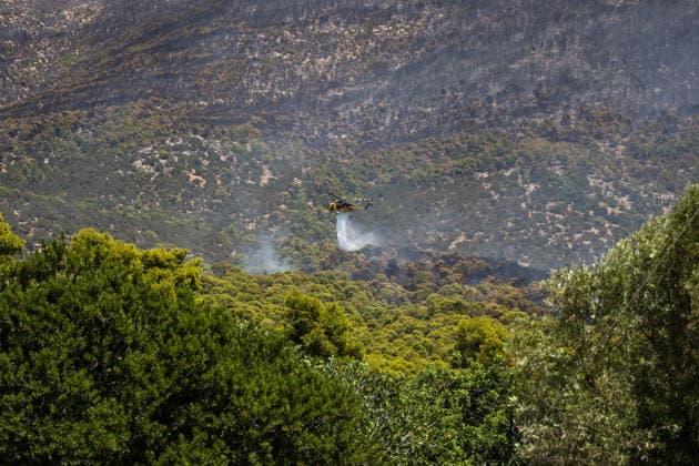 Wildfire continues for fourth day in Psatha, Greece PSATHA, GREECE - AUGUST 04: Helicopters continue firefighting operations as a wildfire burns for the fourth consecutive day in Psatha, Greece, on August 04, 2026. Thousands of square meters of forest, along with several houses, have been destroyed. Although the fire fronts have calmed after four days of intense burning, authorities remain on alert. Aris Oikonomou Anadolu Psatha Greece. Editorial use only. Please get in touch for any other usage.  Copyright: x2026xAnadoluxArisxOikonomoux