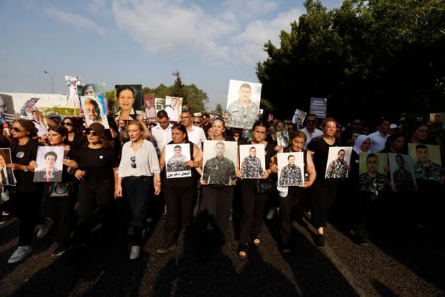 August 4, 2026, Beirut, Beirut, lebanon: Families of victims of the 2020 Beirut Port explosion take part in a central memorial march marking the sixth anniversary of the disaster in Beirut, Lebanon, on August 4, 2026. The march begins at the Beirut Fire Brigade while a second procession starts from Martyrs Square, with both converging near the Emigrant Statue facing the Beirut Port. Participants carry portraits of their relatives who were killed in the massive explosion as they continue to demand truth and justice Beirut lebanon - ZUMAb339 20260804_znp_b339_007 Copyright: xAbdulxKaderxAlxBayx