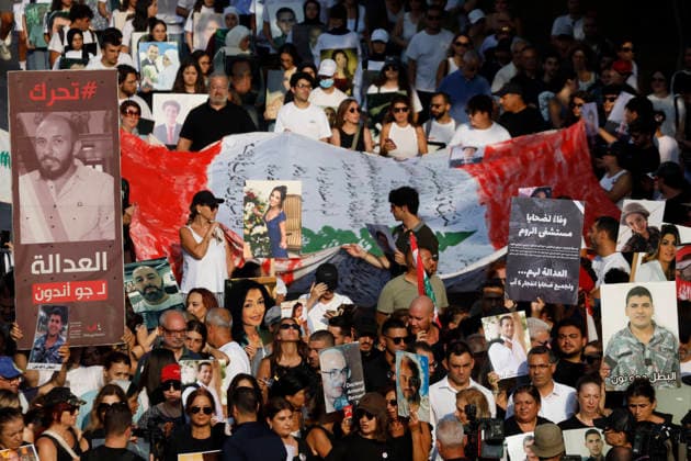 August 4, 2026, Beirut, Beirut, lebanon: Families of victims of the 2020 Beirut Port explosion take part in a central memorial march marking the sixth anniversary of the disaster in Beirut, Lebanon, on August 4, 2026. The march begins at the Beirut Fire Brigade while a second procession starts from Martyrs Square, with both converging near the Emigrant Statue facing the Beirut Port. Participants carry portraits of their relatives who were killed in the massive explosion as they continue to demand truth and justice Beirut lebanon - ZUMAb339 20260804_znp_b339_008 Copyright: xAbdulxKaderxAlxBayx
