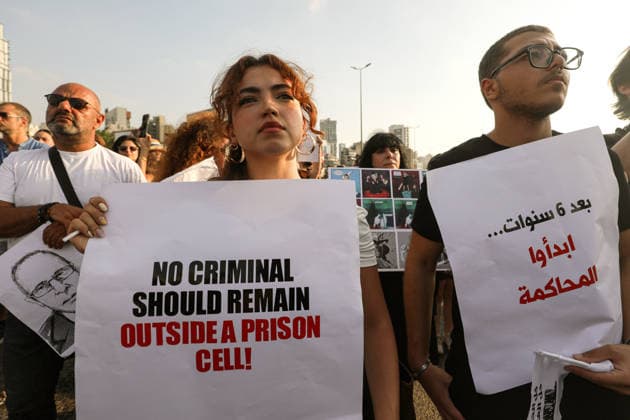 August 4, 2026, Beirut, Beirut, Lebanon: Activists hold banners demanding justice and accountability during a ceremony to mark the six anniversary of the massive explosion that killed more than 200 people and injuring more than 6,500 others. Lebanese authorities have said the explosion was triggered by a fire in a warehouse where tones of ammonium nitrate fertilizer had been stored haphazardly for years, despite repeated warnings to senior officials. Beirut Lebanon - ZUMAn313 20260804_zip_n313_002 Copyright: xMarwanxNaamanix