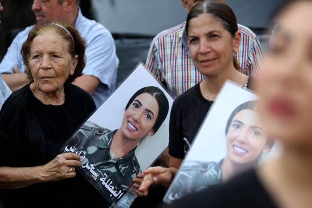 (260804) -- BEIRUT, Aug. 4, 2026 -- People hold portraits of the victims in commemoration of the sixth anniversary of the 2020 Beirut port blasts in Beirut, Lebanon, Aug. 4, 2026. ) LEBANON-BEIRUT-PORT BLAST-6TH ANNIVERSARY BilalxJawich 