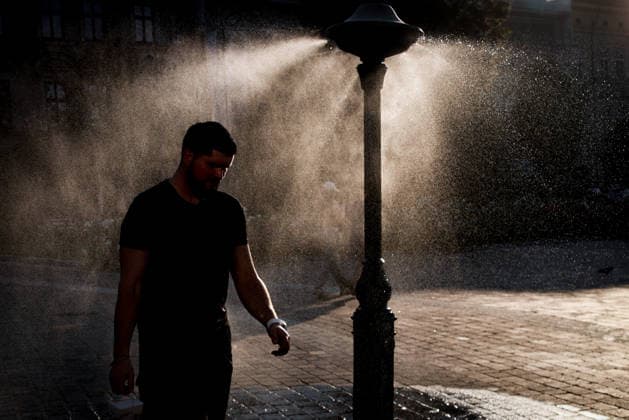 Another Heat Wave In Poland A person cools down by a water sprinkler at the Podgorski Square in Krakow, Poland on August 4th, 2026. An intense heat wave is peaking in Poland with temperatures hitting up to 40Â°C and driving an extreme risk of wildfires across Europe. Krakow Poland  Copyright: xBeataxZawrzelx originalFilename: zawrzel-anotherh260804_np8bO.jpg