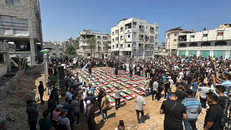 Gaza City Funeral Procession A crowd gathers during a funeral procession for Palestinians whose bodies were recovered from under the rubble of a residential block in the Sabra neighborhood of Gaza City, Gaza on August 4, 2026. The ceremony was held for around 100 people who were found after nearly three years of war in Gaza. Gaza Gaza Strip Palestinian Territories Copyright: xDoaaxAlbazx