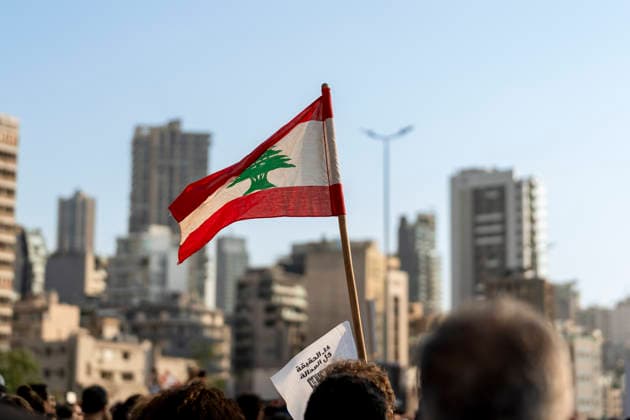 Beirut Lebanon Blast Anniversary A participant holds a Lebanese flag among the crowd during a commemoration marking the sixth anniversary of the Beirut port explosion in Beirut, Lebanon on August 4, 2026. The blast on August 4, 2020, killed more than 220 people, injured thousands and displaced hundreds of thousands, while victims™ families continue to demand justice and accountability. Beirut Beirut Lebanon Copyright: xSilviaxCasadeix