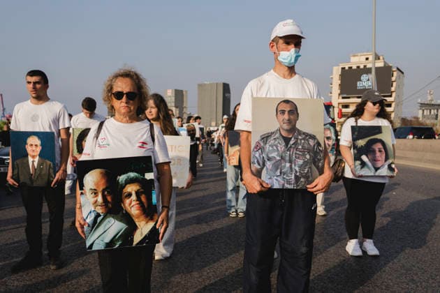 Beirut Port Blast Anniversary Commemoration Participants carry portraits of people killed in the Beirut Port explosion during a commemoration marking its sixth anniversary in Beirut, Lebanon, on August 4, 2026. The August 4, 2020 blast, caused by ammonium nitrate stored at the port, killed more than 200 people, injured thousands and devastated large parts of the Lebanese capital. Beirut Beirut Lebanon Copyright: xManonxRocax