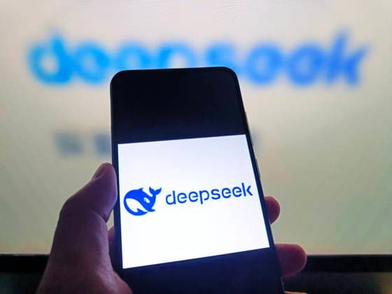 DeepSeek SUQIAN, CHINA - AUGUST 5, 2026 - A netizen is using his mobilephone to view DeepSeek logo and using his computer to view DeepSeek webpage in Suqian, Jiangsu, China on August 5, 2026. Suqian Jiangsu China  Copyright: xCFOTOx i1785933363642