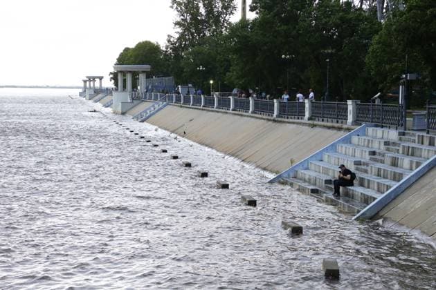 Russia Floods 9217393 05.08.2026 A view shows the flooded embankment of the Amur River as water levels rise in Khabarovsk, Russia. The river has risen above four metres, with the danger level set at six metres. Evgenie Pereverzev Sputnik Khabarovsk Russia  Copyright: xEvgeniexPereverzevx