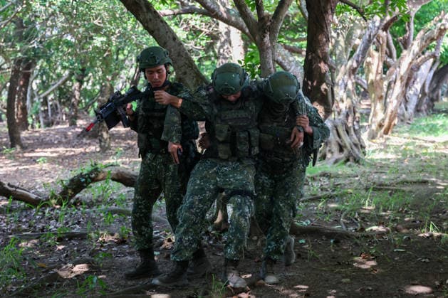 Taiwan kicks off Han-Kuang military exercises as tensions with China rise PENGHU COUNTY, TAIWAN - AUGUST 5: A Taiwanese Army soldiers save their gun-wounded fellow, during an operation simulating a response to grey-zone attacks on key infrastructure by Chinese special agents, as part of the Han-Kuang military exercise, at a power station in Penghu County, Taiwan on August 5, 2026. The Han-Kuang exercises, which kicked off today, will last for 10-days with different unscripted drills simulating response to a possible invasion by China, amid Beijing s increasing military activities around the Taiwan Strait and the South China Sea. Daniel Ceng Anadolu Penghu County Taiwan. Editorial use only. Please get in touch for any other usage.  Copyright: x2026xAnadoluxDanielxCengx