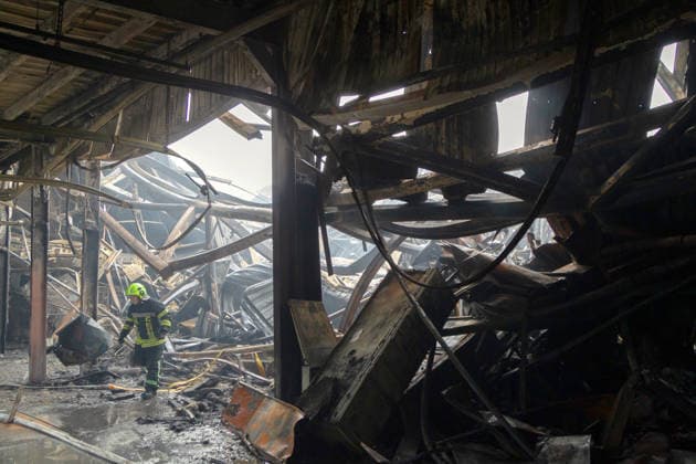 A State Emergency Service rescuer works at a logistics centre of the home improvement company destroyed by an overnight Russian strike in Kyiv, Ukraine, August 5, 2026. The facility on the Left Bank of the Ukrainian capital served as one of the key distribution hubs and an order collection centre for the hypermarket chain. (Photo by Kyrylo Chubotin Ukrinform) Logistics centre of home improvement company destroyed by Russian attack on Kyiv  Copyright: xKirillxChubotinx