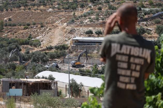 Israeli army demolishes homes and industrial facility near Bethlehem NAHALIN, WEST BANK AUGUST 5, 2026: Israeli army bulldozers demolish two residential homes and an industrial facility in the village of Nahalin, west of Bethlehem, in the occupied West Bank. Israeli authorities said the structures had been built without permits in Area C, a part of the West Bank that remains under full Israeli civil and military control under the Oslo Accords. NAHALIN Palestine, State of Copyright: x xMosabxshawerx xJNAxPressx